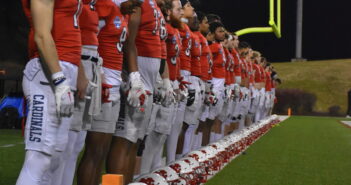 A photo of the Cardinal football team lined up before the start of the 2023 Stagg Bowl.