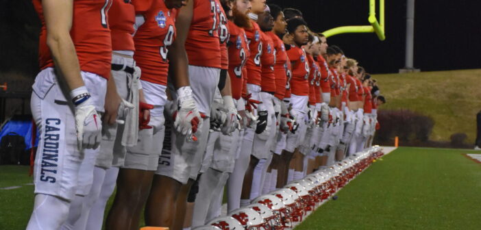 A photo of the Cardinal football team lined up before the start of the 2023 Stagg Bowl.