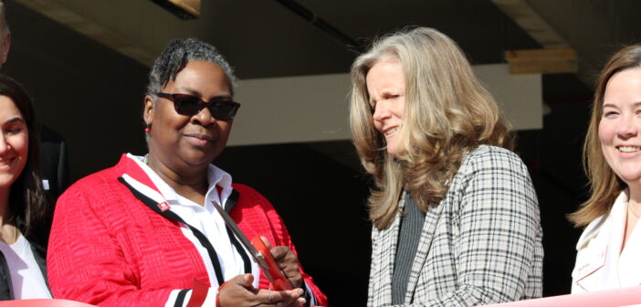 Dr. Anita Thomas (Left) and Ill. State Senator Laura Ellman (Right) cutting the ribbon.