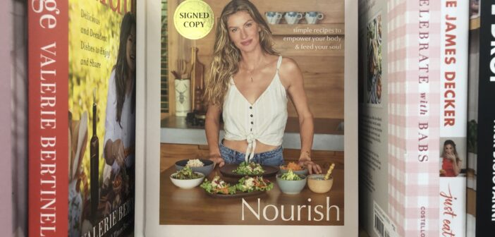 A photograph of the cookbook, "Nourish," by Gisele Bündchen.
