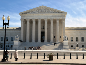 A group of people gathered at the Supreme Court of the United States in Washington D.C.